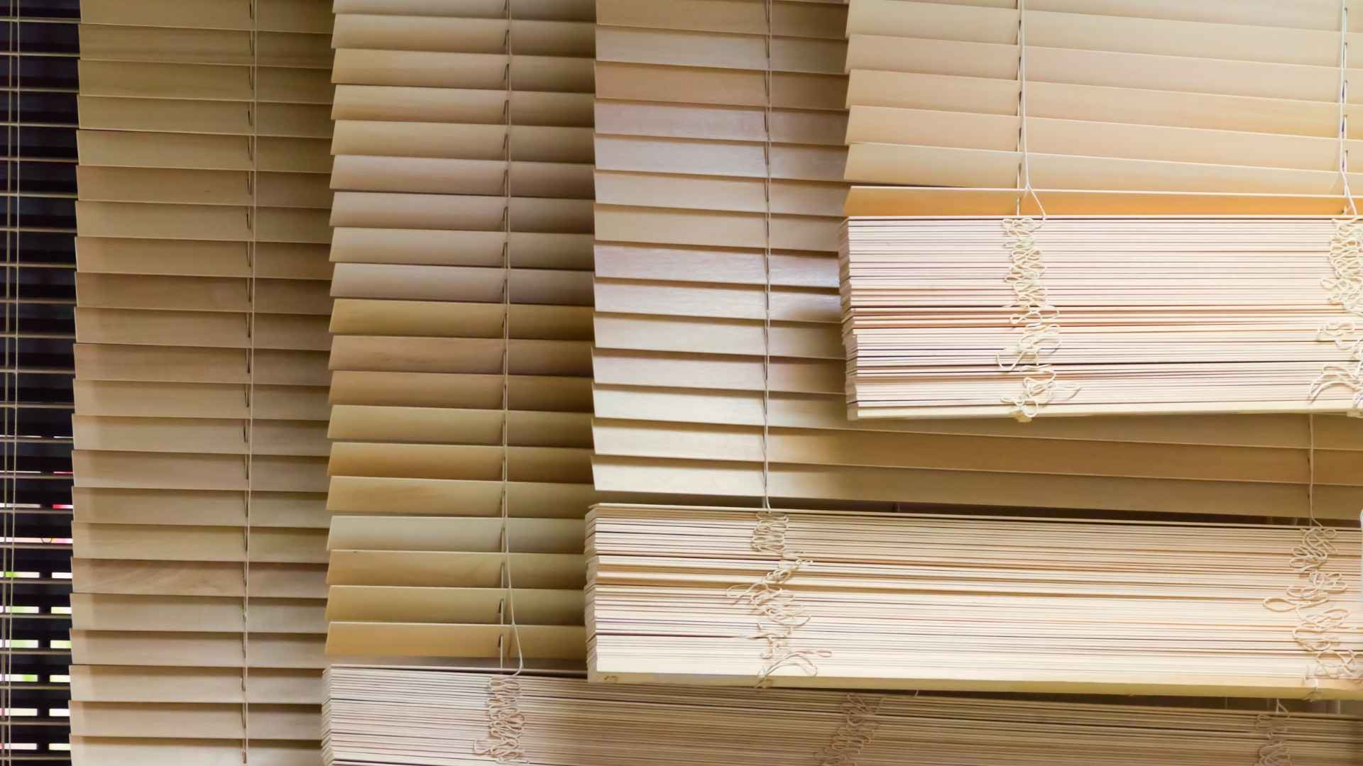 a row of multiple sets of venetian blinds