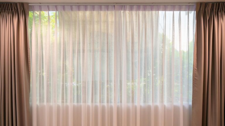 rod pocket drapes in michigan white curtain drapes with grey accents looking out of window